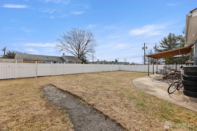 view of yard with a patio and a fenced backyard