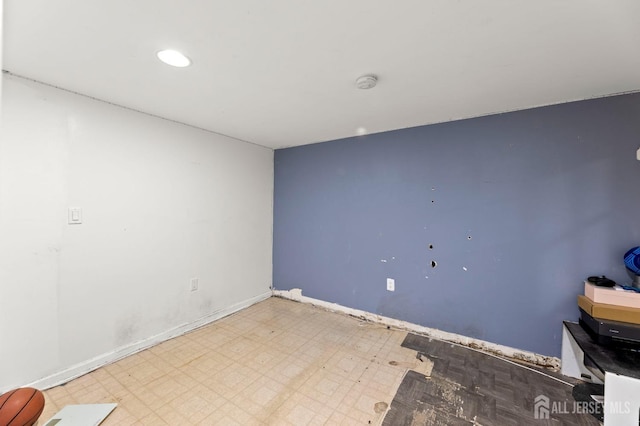 unfurnished room featuring tile patterned floors, baseboards, and recessed lighting