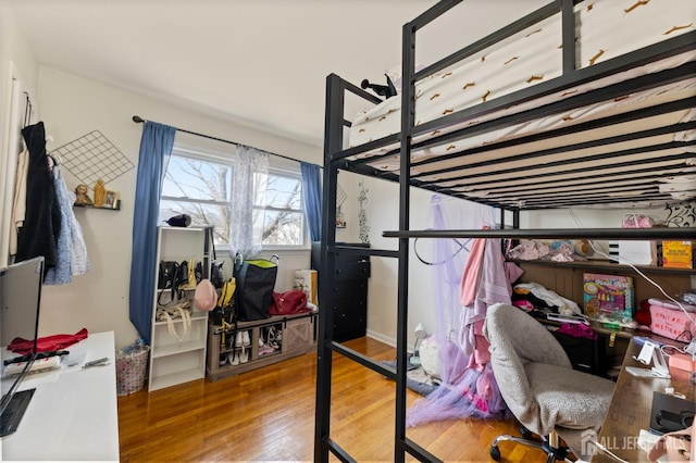 bedroom featuring wood finished floors