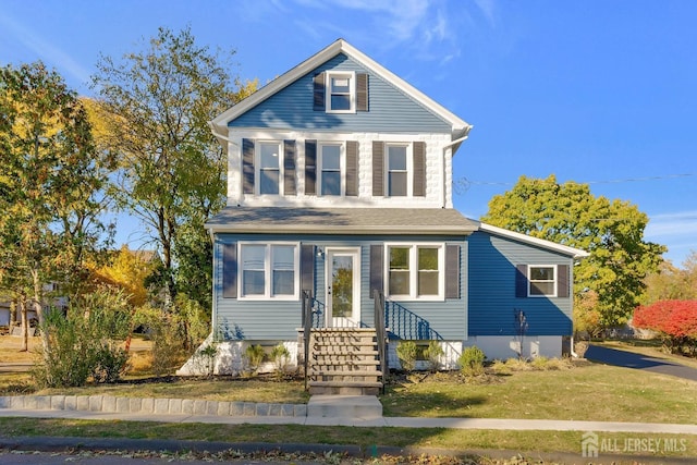 front facade with a front lawn