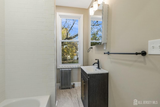 bathroom with vanity and radiator heating unit