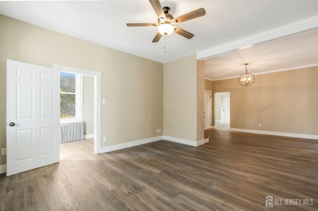 unfurnished room with ceiling fan with notable chandelier and dark hardwood / wood-style floors