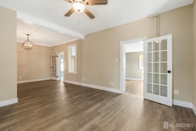 unfurnished room featuring dark hardwood / wood-style floors, ceiling fan with notable chandelier, and french doors