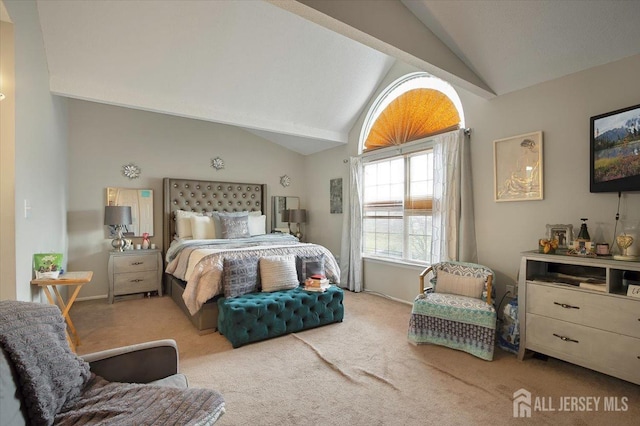 bedroom featuring vaulted ceiling and carpet