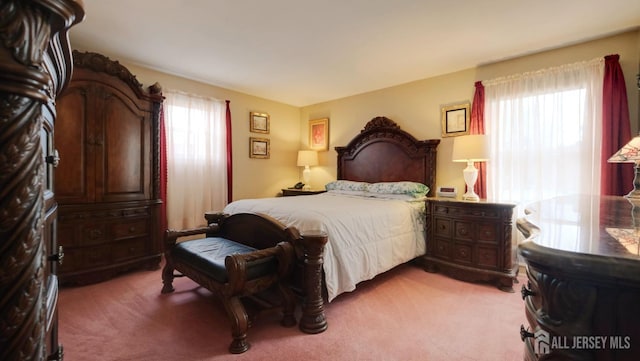 bedroom with light carpet