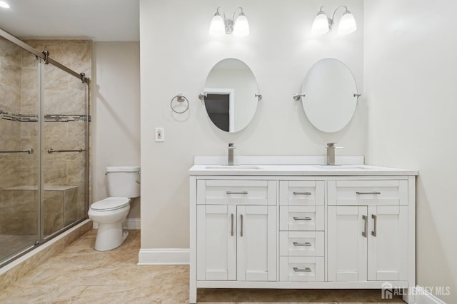 full bathroom with toilet, a shower stall, double vanity, and a sink