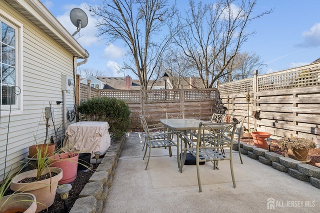 view of patio / terrace featuring a fenced backyard and outdoor dining space