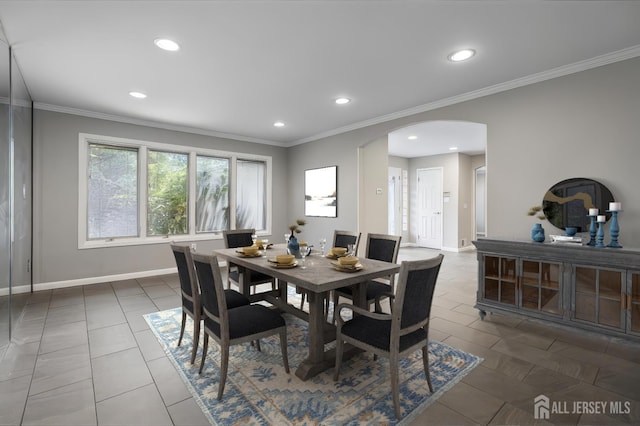 16 Darby Rd, East Brunswick, NJ 08816 - tiled dining space with arched walkways, recessed lighting, baseboards, and crown molding