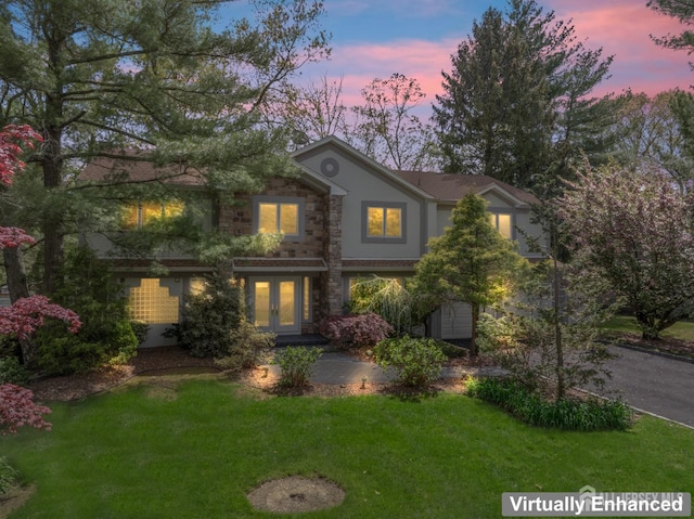 16 Darby Rd, East Brunswick, NJ 08816 - view of front of house with french doors, stucco siding, and a yard