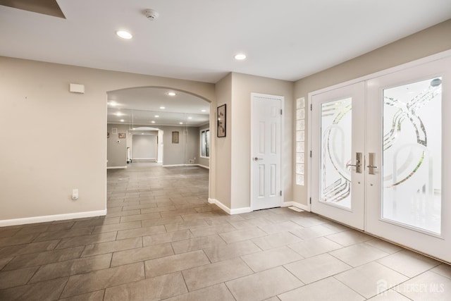 16 Darby Rd, East Brunswick, NJ 08816 - tiled foyer with arched walkways, recessed lighting, baseboards, and french doors