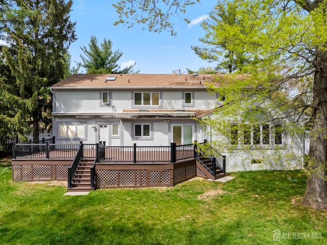 16 Darby Rd, East Brunswick, NJ 08816 - rear view of house with stairway, a wooden deck, stucco siding, and a yard