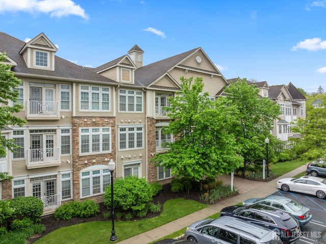 2206 Cedar Village Blvd, East Brunswick, NJ 08816 - view of property featuring uncovered parking