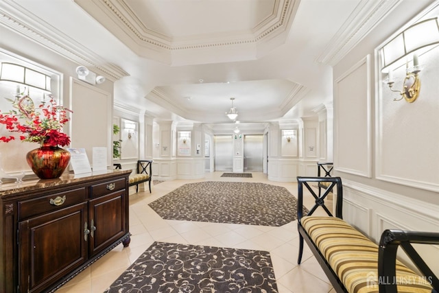 2206 Cedar Village Blvd, East Brunswick, NJ 08816 - hallway with a decorative wall, a tray ceiling, light tile patterned floors, crown molding, and decorative columns