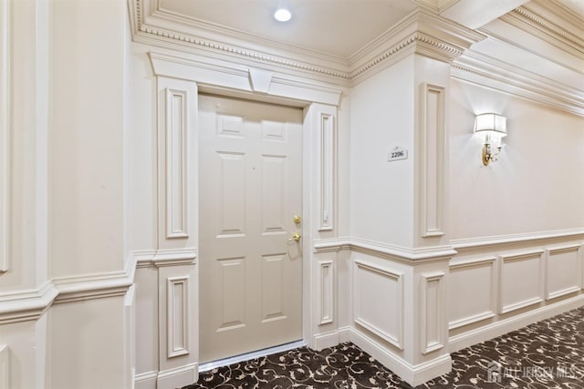 2206 Cedar Village Blvd, East Brunswick, NJ 08816 - entrance foyer with a decorative wall, a wainscoted wall, and crown molding