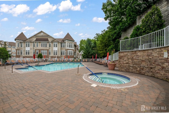 2206 Cedar Village Blvd, East Brunswick, NJ 08816 - community pool with a hot tub and a patio