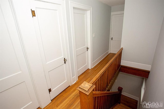 stairway featuring hardwood / wood-style floors