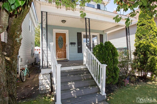 doorway to property with a porch