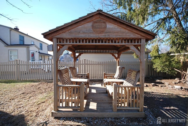 wooden deck featuring fence and a gazebo