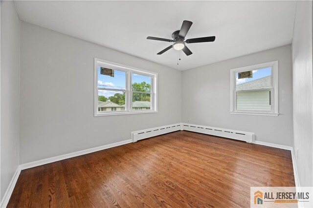 11 Amendola Dr, Netcong, NJ 07857 - unfurnished room with wood finished floors, baseboards, and a ceiling fan