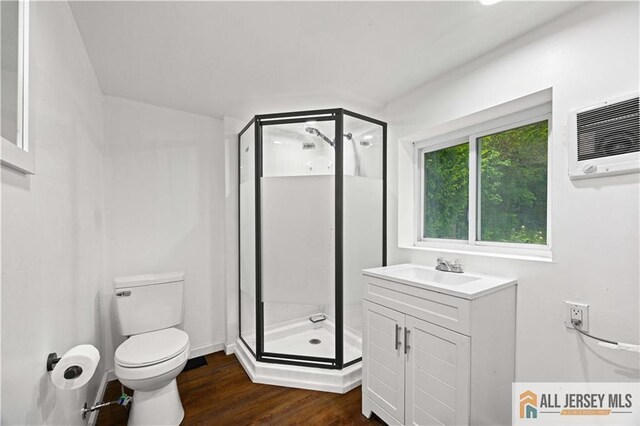 11 Amendola Dr, Netcong, NJ 07857 - bathroom featuring toilet, a stall shower, wood finished floors, and vanity