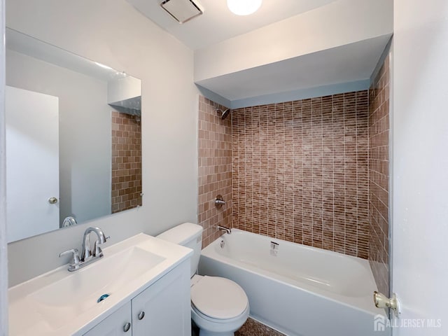 full bathroom featuring visible vents, bathing tub / shower combination, toilet, and vanity