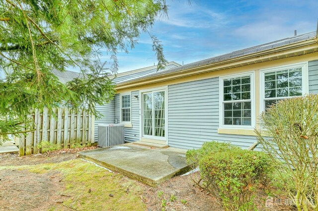 exterior space with a patio area and central AC