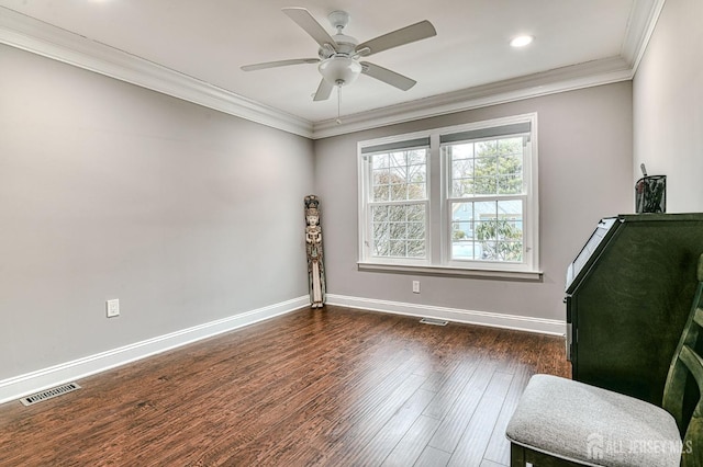 interior space featuring ceiling fan, dark hardwood / wood-style flooring, and crown molding