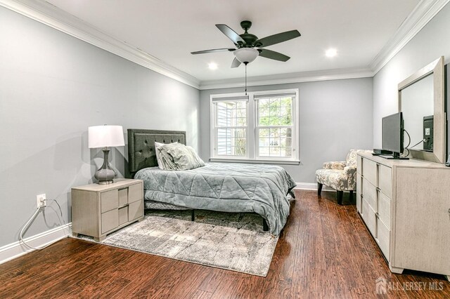 bedroom with dark hardwood / wood-style flooring, ceiling fan, and crown molding