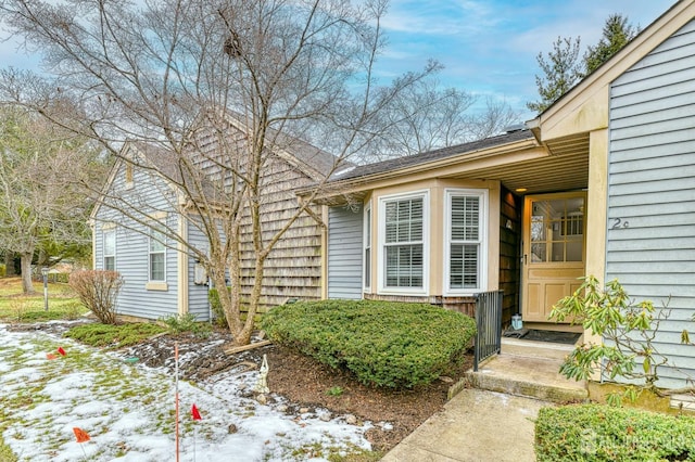 view of snow covered property entrance