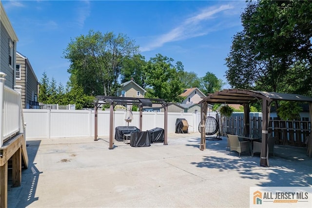 212 Freeman St, Woodbridge Proper, NJ 07095 - fenced backyard with a patio, outdoor dining area, and a pergola