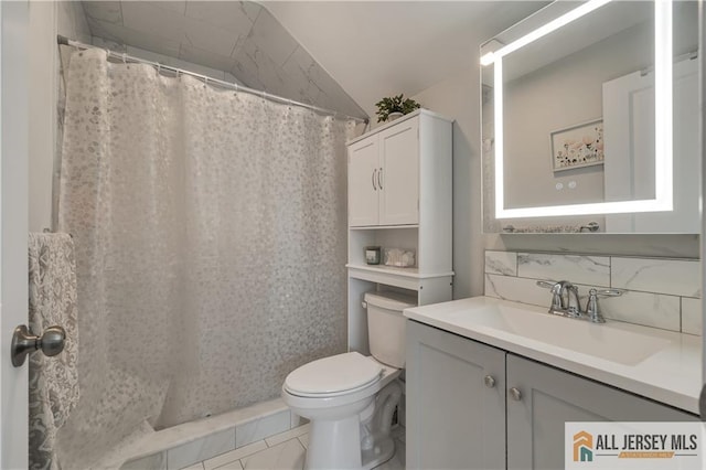 212 Freeman St, Woodbridge Proper, NJ 07095 - full bathroom with vanity, a shower with shower curtain, tasteful backsplash, and lofted ceiling