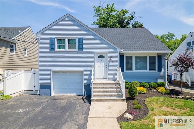 212 Freeman St, Woodbridge Proper, NJ 07095 - view of front of property with driveway and an attached garage