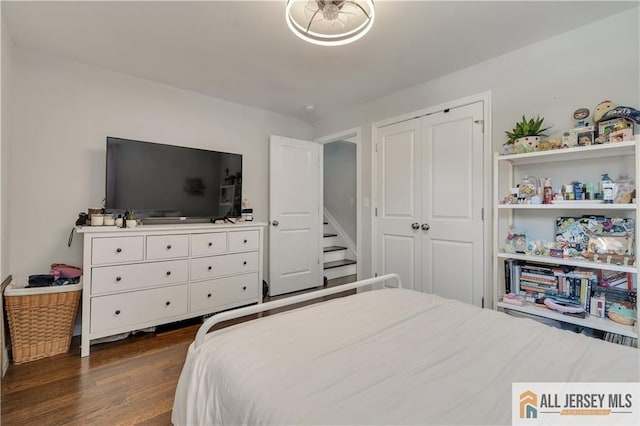 212 Freeman St, Woodbridge Proper, NJ 07095 - bedroom with dark wood-type flooring and a closet