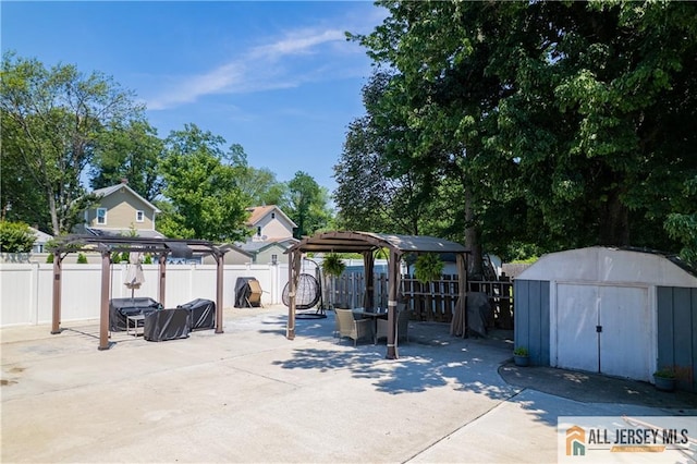 212 Freeman St, Woodbridge Proper, NJ 07095 - fenced backyard with a patio, a gazebo, and a storage shed