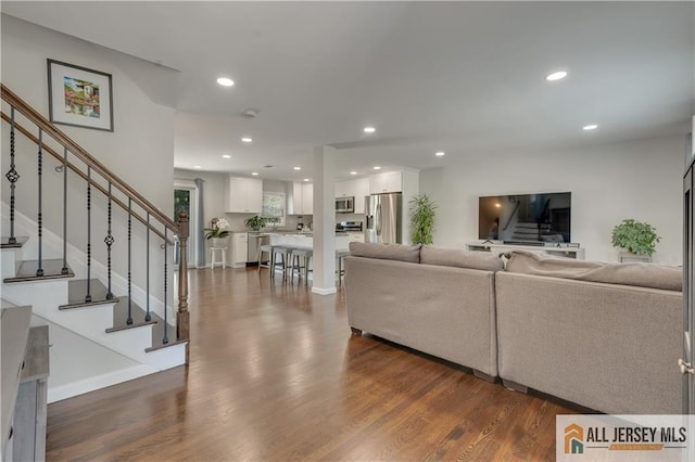 212 Freeman St, Woodbridge Proper, NJ 07095 - living area with stairway, dark wood-type flooring, and recessed lighting