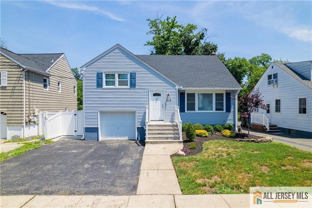212 Freeman St, Woodbridge Proper, NJ 07095 - view of front of home featuring driveway, a gate, and a garage