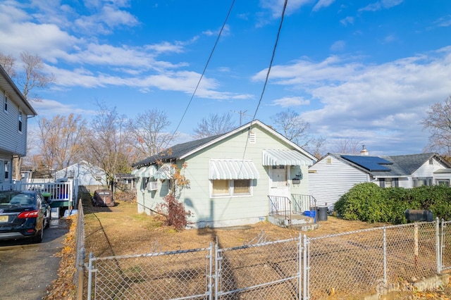 136-136 Hilltop Blvd, Old Bridge, NJ 07735 - view of side of home with a gate, a fenced front yard, and driveway