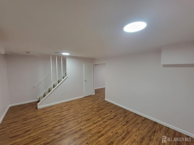 basement featuring hardwood / wood-style floors