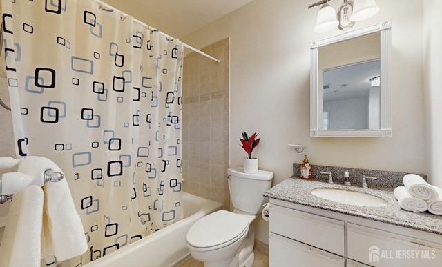 bathroom with toilet, shower / bath combo, and vanity