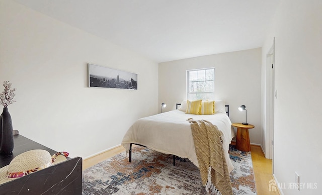 bedroom with light wood-style floors