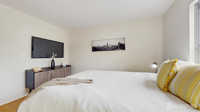 bedroom with light wood finished floors