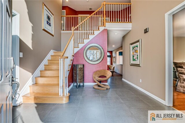 entryway with a high ceiling