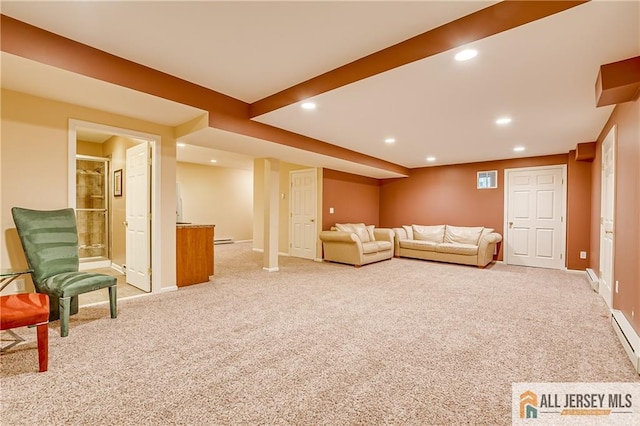 carpeted living room with a baseboard heating unit