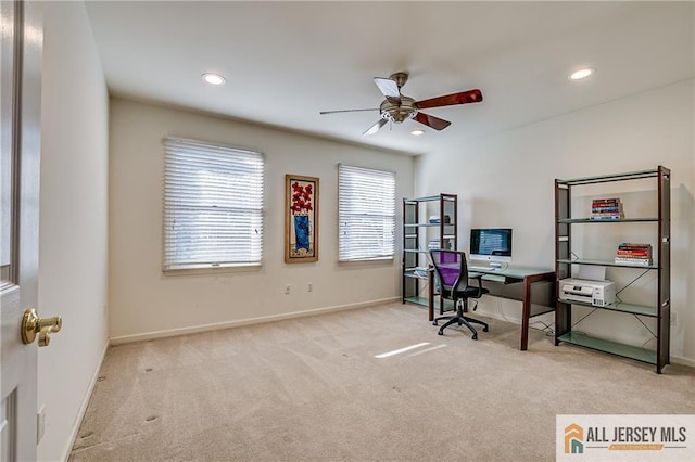 home office with ceiling fan and light colored carpet