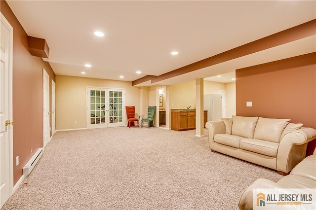 living room featuring baseboard heating, carpet flooring, sink, and french doors