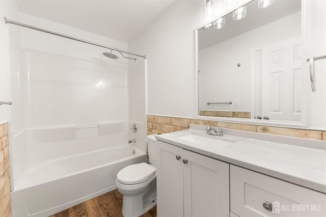 50 Ellen Heath Dr, Matawan, NJ 07747 - full bath featuring vanity, toilet, bathtub / shower combination, wood finished floors, and wainscoting