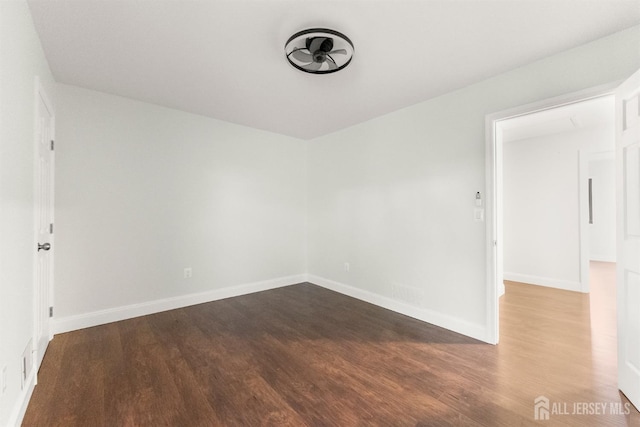 50 Ellen Heath Dr, Matawan, NJ 07747 - unfurnished room with dark wood-style flooring and baseboards