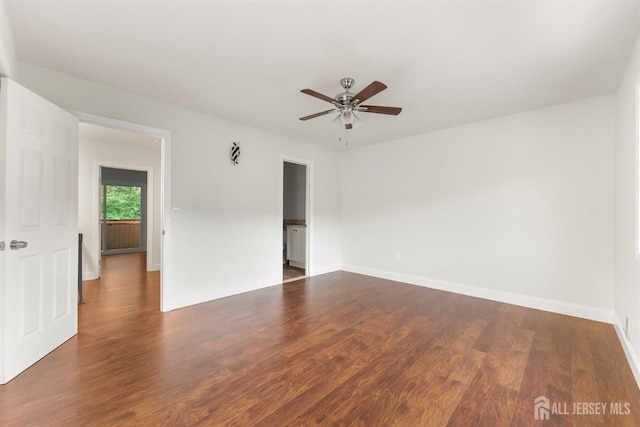 50 Ellen Heath Dr, Matawan, NJ 07747 - unfurnished room with dark wood-type flooring, a ceiling fan, and baseboards