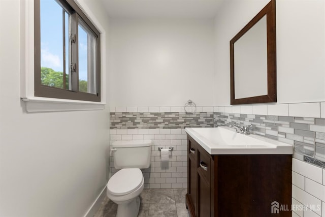 50 Ellen Heath Dr, Matawan, NJ 07747 - bathroom with vanity, toilet, tile walls, and tile patterned flooring