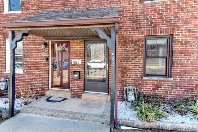 entrance to property with brick siding